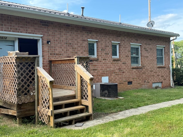 2612 Webster Rd, Roanoke, VA 24012 - rear view of house featuring crawl space, brick siding, a wooden deck, and a lawn