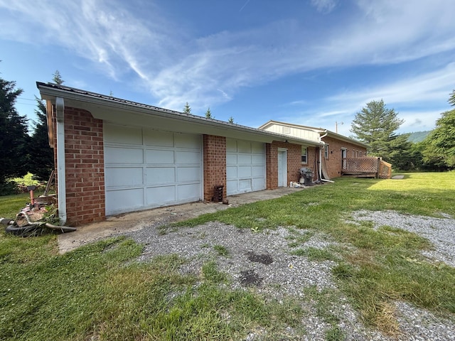 2612 Webster Rd, Roanoke, VA 24012 - rear view of property featuring brick siding, a yard, and a garage