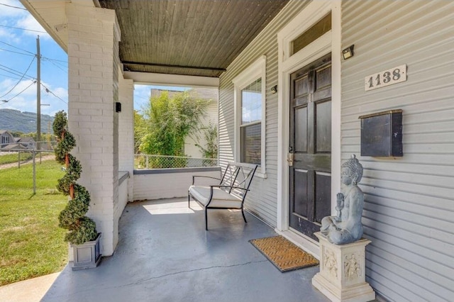 1138 Montrose Ave SE, Roanoke, VA 24013 - covered porch with a lawn