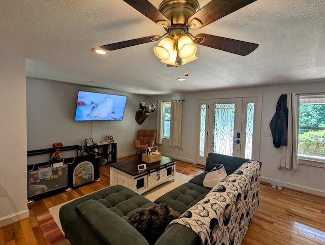 221 Camp Creek Rd NW, Riner, VA 24149 - living room with healthy amount of natural light, a textured ceiling, light wood finished floors, ceiling fan, and recessed lighting
