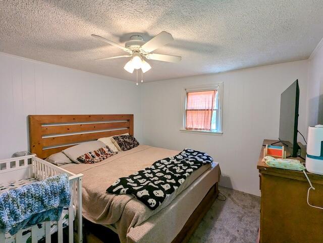 221 Camp Creek Rd NW, Riner, VA 24149 - bedroom featuring carpet floors, a textured ceiling, and ceiling fan