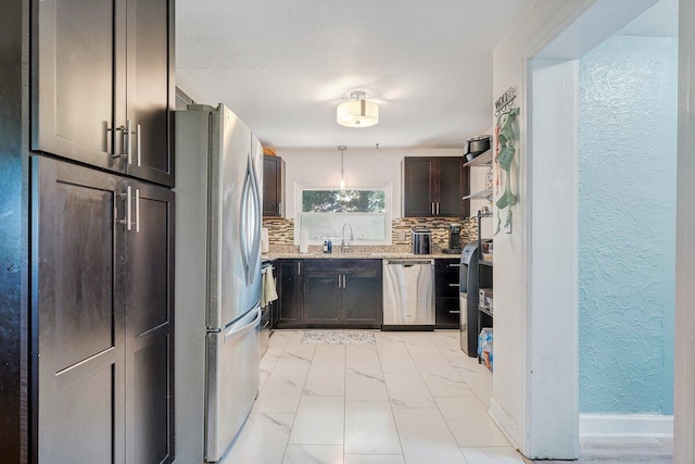 105 Barnette Rd, Salem, VA 24153 - kitchen with appliances with stainless steel finishes, a textured wall, light marble finish flooring, backsplash, and dark brown cabinetry
