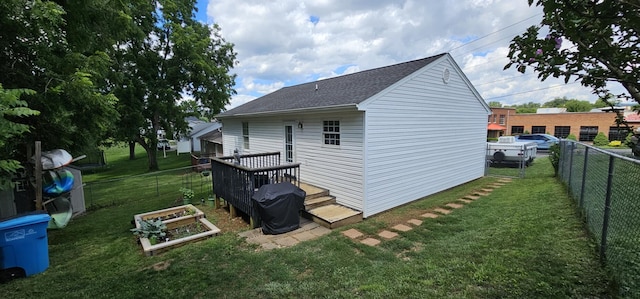 2610 Plantation Rd NE, Roanoke, VA 24012 - view of home's exterior featuring a fenced backyard, roof with shingles, and a vegetable garden