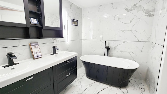 801 Concord St, Selma, VA 24474 - bathroom featuring marble tiled flooring, double vanity, a freestanding tub, and tile walls