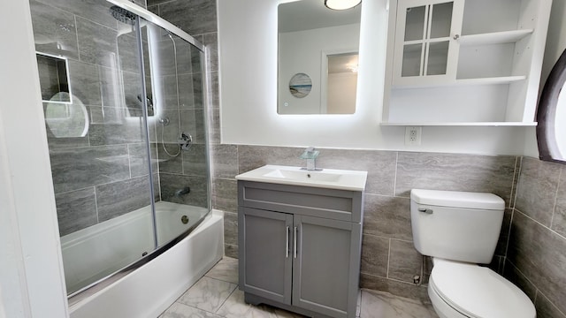 801 Concord St, Selma, VA 24474 - full bath with tile walls, vanity, marble finish flooring, and enclosed tub / shower combo