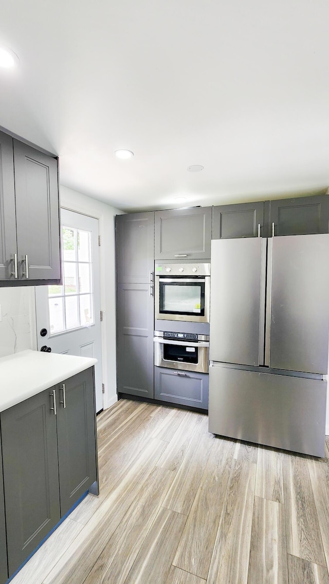 801 Concord St, Selma, VA 24474 - kitchen featuring freestanding refrigerator, gray cabinetry, light wood-type flooring, light countertops, and recessed lighting