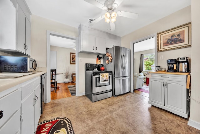 3843 Plantation Rd NE, Roanoke, VA 24012 - kitchen featuring stainless steel appliances, ceiling fan, light countertops, and white cabinets