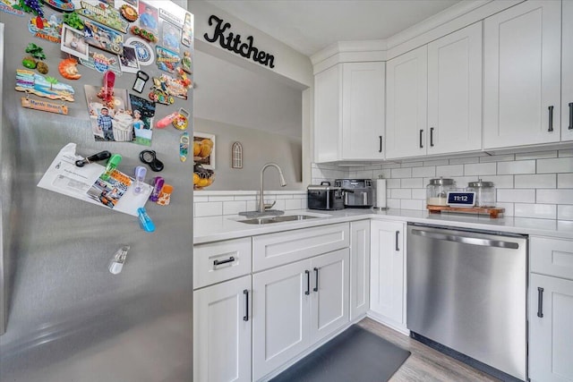 901 Samantha Cir, Roanoke, VA 24019 - kitchen featuring stainless steel appliances, light countertops, tasteful backsplash, white cabinetry, and wood finished floors