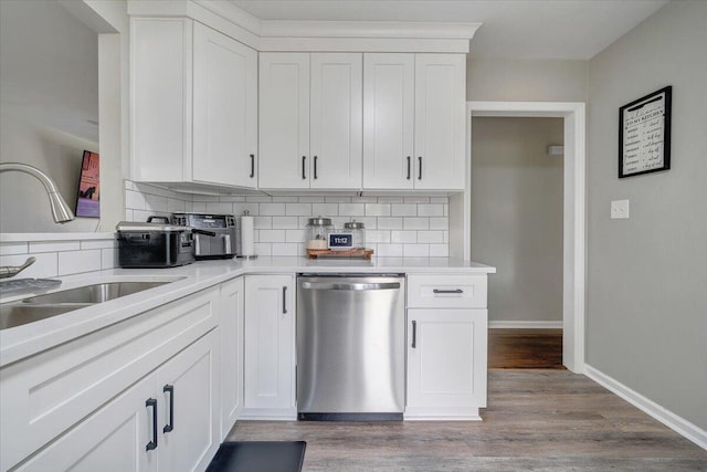 901 Samantha Cir, Roanoke, VA 24019 - kitchen with stainless steel dishwasher, backsplash, wood finished floors, white cabinetry, and light countertops