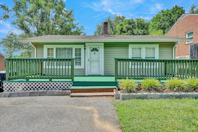 3653 Bunker Hill Dr, Roanoke, VA 24018 - bungalow-style home with a chimney and a wooden deck