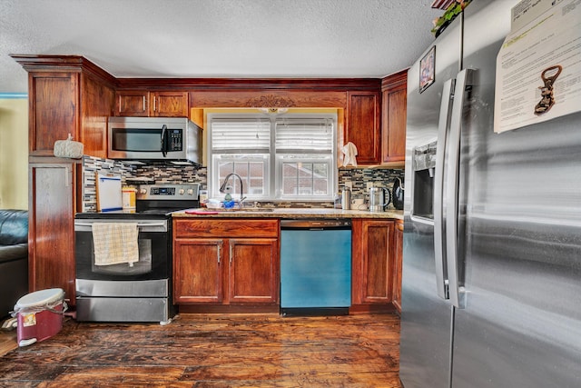 3653 Bunker Hill Dr, Roanoke, VA 24018 - kitchen with appliances with stainless steel finishes, decorative backsplash, dark wood-style floors, and a textured ceiling