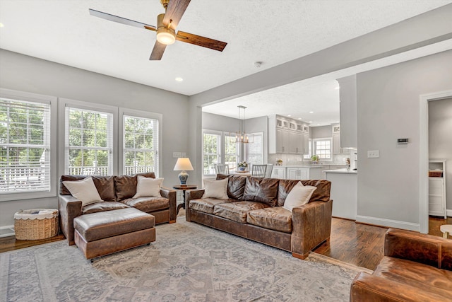 1258 Colby Dr, Forest, VA 24551 - living room featuring wood finished floors, a ceiling fan, recessed lighting, and a chandelier