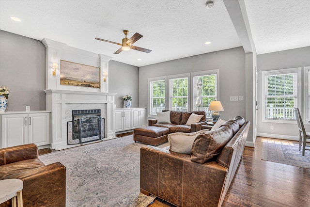 1258 Colby Dr, Forest, VA 24551 - living room with a textured ceiling, ceiling fan, wood finished floors, a fireplace, and recessed lighting