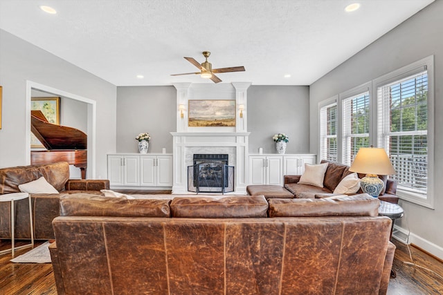 1258 Colby Dr, Forest, VA 24551 - living room featuring dark wood-style floors, ceiling fan, a textured ceiling, recessed lighting, and a high end fireplace
