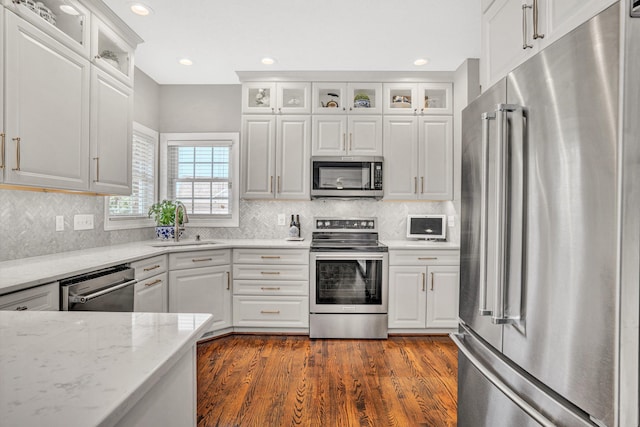 1258 Colby Dr, Forest, VA 24551 - kitchen featuring stainless steel appliances, white cabinetry, light stone countertops, decorative backsplash, and recessed lighting