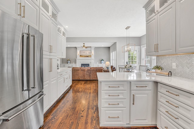 1258 Colby Dr, Forest, VA 24551 - kitchen featuring high quality fridge, open floor plan, a fireplace, dark wood-type flooring, and a ceiling fan