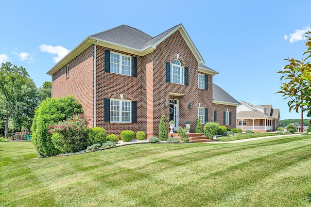 1258 Colby Dr, Forest, VA 24551 - view of front facade featuring brick siding, a front lawn, and roof with shingles