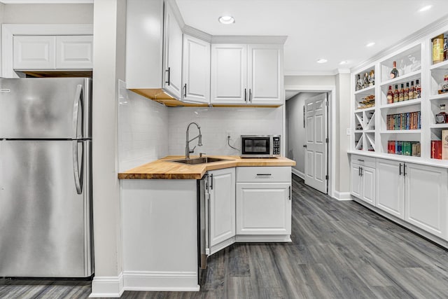 1258 Colby Dr, Forest, VA 24551 - kitchen with appliances with stainless steel finishes, wooden counters, dark wood-style floors, white cabinetry, and decorative backsplash