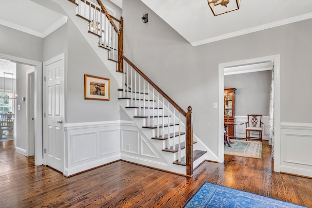 1258 Colby Dr, Forest, VA 24551 - stairs with wood finished floors, ornamental molding, wainscoting, a decorative wall, and a chandelier