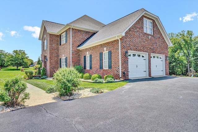 1258 Colby Dr, Forest, VA 24551 - view of front of house with brick siding, driveway, roof with shingles, an attached garage, and a front lawn