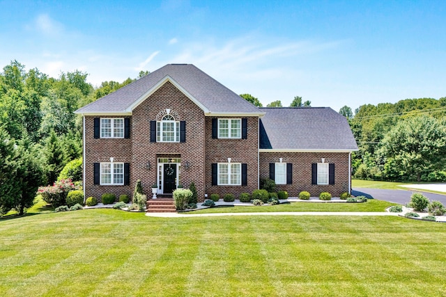 1258 Colby Dr, Forest, VA 24551 - colonial house with a front lawn, brick siding, and roof with shingles