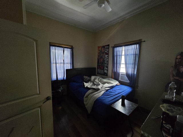 1213 Tazewell Ave SE, Roanoke, VA 24013 - bedroom with multiple windows, dark wood-style flooring, ceiling fan, and cooling unit