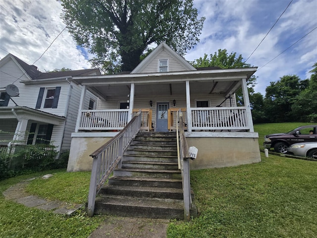1213 Tazewell Ave SE, Roanoke, VA 24013 - view of front of property featuring a front lawn, a porch, and stairs