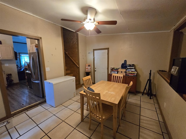 1213 Tazewell Ave SE, Roanoke, VA 24013 - dining room featuring a ceiling fan, light tile patterned flooring, and crown molding