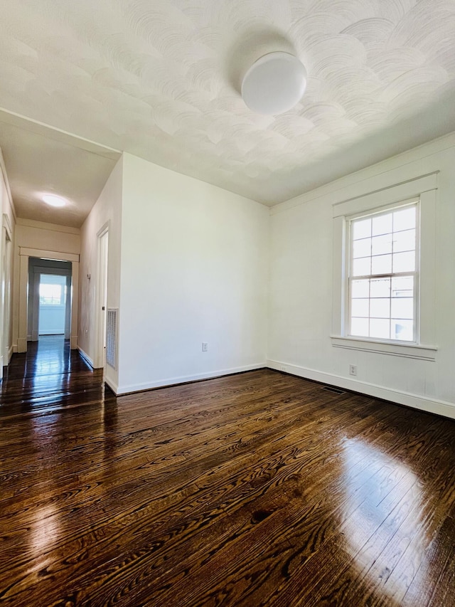 1138 Murray Ave SE, Roanoke, VA 24013 - empty room with wood-type flooring and baseboards