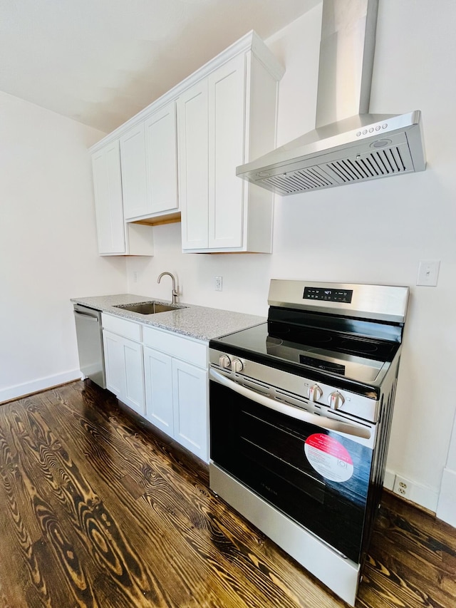 1138 Murray Ave SE, Roanoke, VA 24013 - kitchen with appliances with stainless steel finishes, wall chimney exhaust hood, dark wood-style floors, and white cabinets