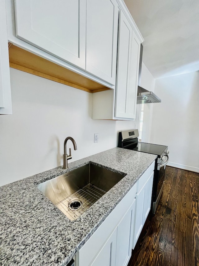 1138 Murray Ave SE, Roanoke, VA 24013 - kitchen featuring stainless steel electric stove, dark wood-type flooring, white cabinetry, light stone countertops, and wall chimney exhaust hood