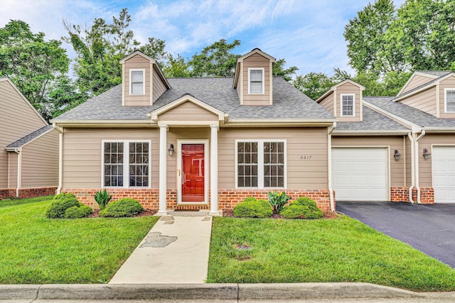 6617 Hartman Ct, Roanoke, VA 24019 - new england style home featuring brick siding, a front lawn, an attached garage, and a shingled roof