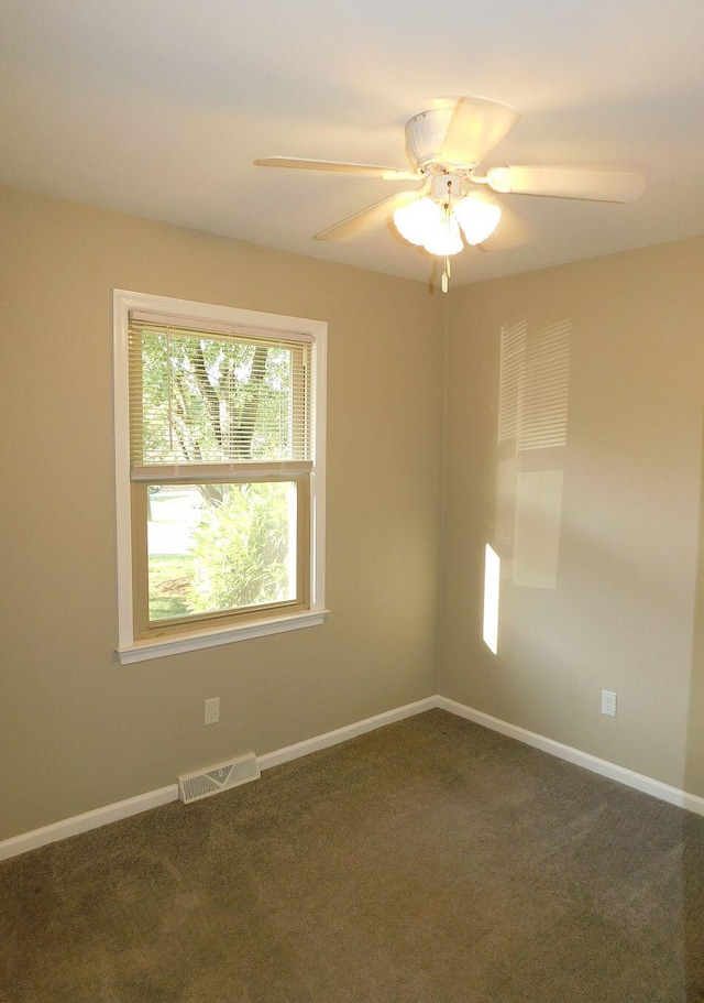 4230 Belford St SW, Roanoke, VA 24018 - empty room featuring a ceiling fan and dark carpet