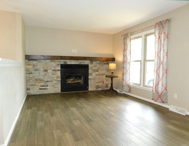 4230 Belford St SW, Roanoke, VA 24018 - unfurnished living room featuring wood finished floors and a fireplace