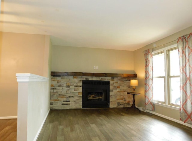 4230 Belford St SW, Roanoke, VA 24018 - unfurnished living room featuring wood finished floors and a fireplace