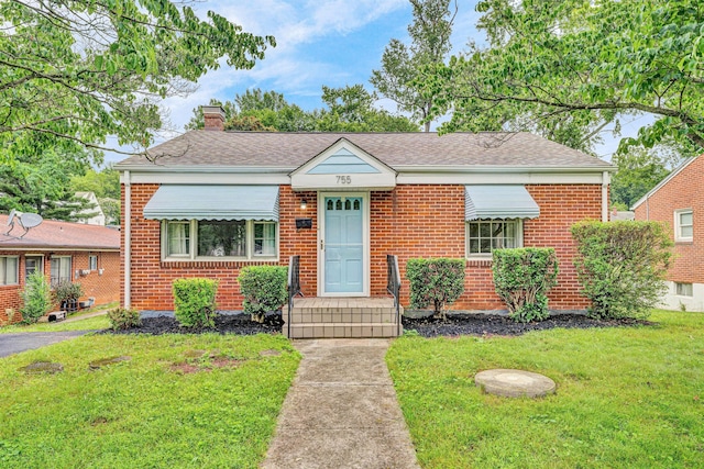 755 Brandon Ave SW, Roanoke, VA 24015 - bungalow-style house featuring a front lawn, a chimney, brick siding, and a shingled roof