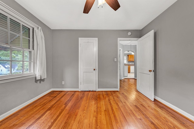 755 Brandon Ave SW, Roanoke, VA 24015 - unfurnished bedroom with light wood finished floors and a ceiling fan