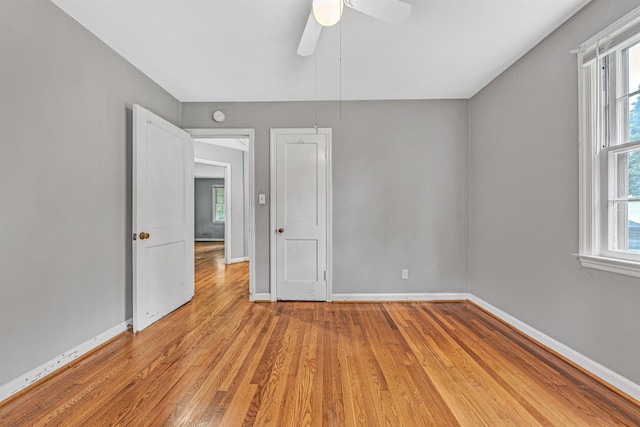 755 Brandon Ave SW, Roanoke, VA 24015 - unfurnished bedroom featuring light wood-style floors and a ceiling fan