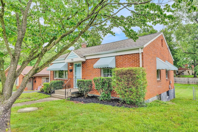 755 Brandon Ave SW, Roanoke, VA 24015 - bungalow with brick siding, a chimney, and a shingled roof