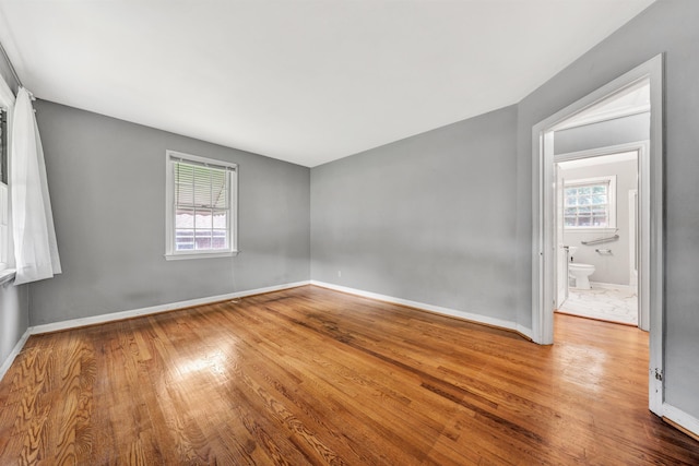 755 Brandon Ave SW, Roanoke, VA 24015 - unfurnished room featuring plenty of natural light and wood finished floors