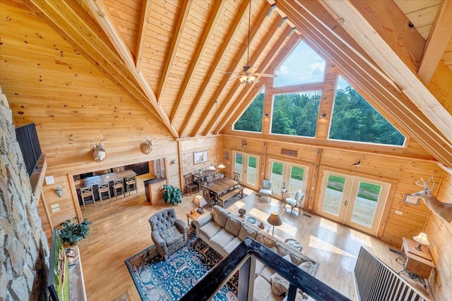 1769 Scenic View Rd, Moneta, VA 24121 - living room featuring wood walls, high vaulted ceiling, a wooden ceiling with exposed beams, french doors, and wood finished floors