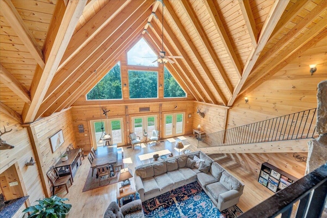 1769 Scenic View Rd, Moneta, VA 24121 - living room featuring wood walls, a wood ceiling with exposed beams, high vaulted ceiling, wood finished floors, and a wood stove