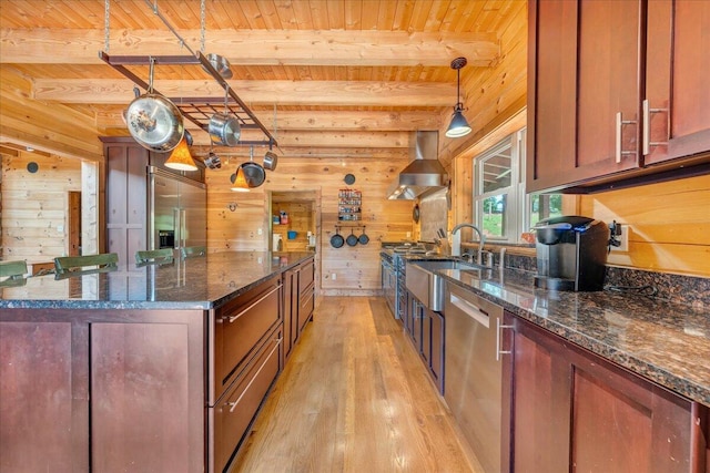 1769 Scenic View Rd, Moneta, VA 24121 - kitchen featuring wall chimney exhaust hood, stainless steel appliances, wooden walls, light wood-type flooring, and a wooden ceiling with exposed beams