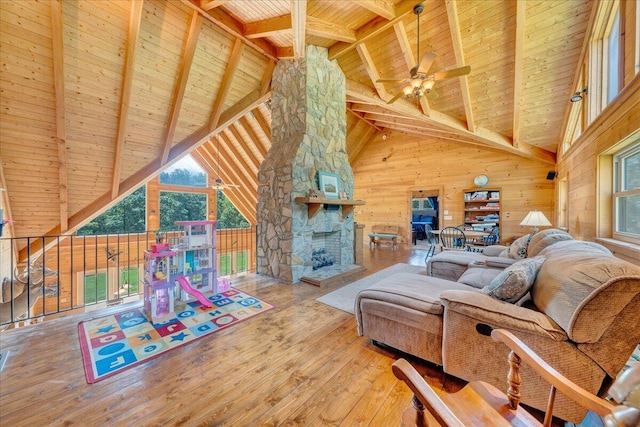1769 Scenic View Rd, Moneta, VA 24121 - living room with a wooden ceiling with exposed beams, wood-type flooring, a ceiling fan, wooden walls, and high vaulted ceiling