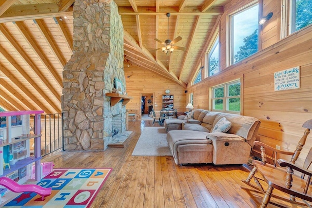 1769 Scenic View Rd, Moneta, VA 24121 - living area featuring a wooden ceiling with exposed beams, hardwood / wood-style flooring, wood walls, high vaulted ceiling, and ceiling fan