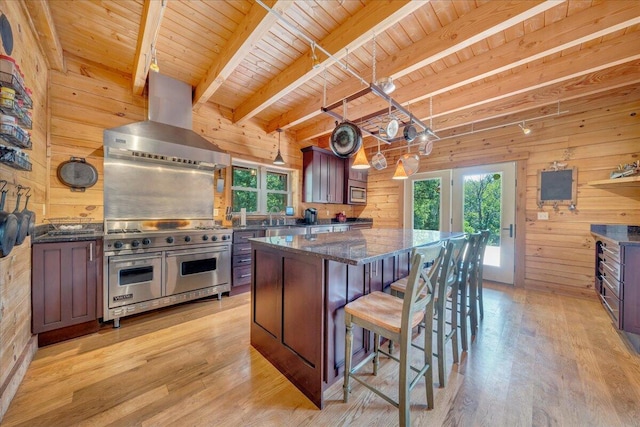1769 Scenic View Rd, Moneta, VA 24121 - kitchen featuring exhaust hood, stainless steel appliances, wood walls, a center island, and a wooden ceiling with exposed beams