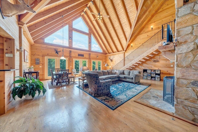 1769 Scenic View Rd, Moneta, VA 24121 - living area featuring high vaulted ceiling, wooden walls, a wood ceiling with exposed beams, wood finished floors, and a ceiling fan