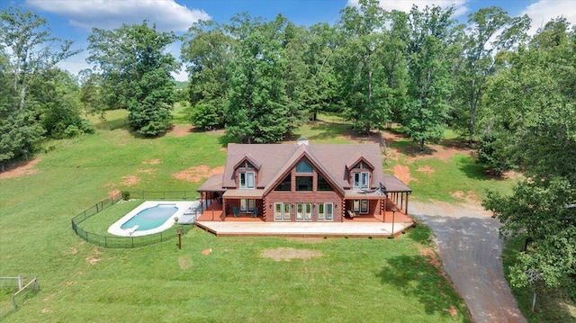 1769 Scenic View Rd, Moneta, VA 24121 - back of house with a deck, an outdoor pool, log exterior, driveway, and view of wooded area
