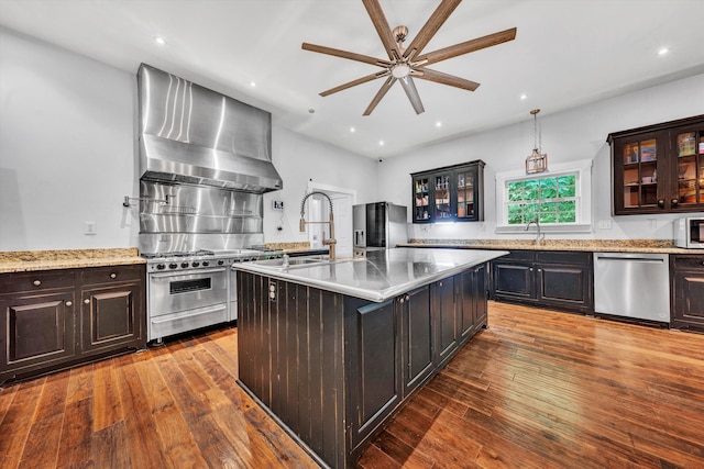 3150 Green Ridge Rd NW, Roanoke, VA 24019 - kitchen with stainless steel appliances, wall chimney range hood, ceiling fan, glass insert cabinets, and dark wood-type flooring
