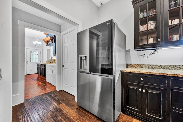 3150 Green Ridge Rd NW, Roanoke, VA 24019 - kitchen featuring stainless steel refrigerator with ice dispenser, dark wood-style flooring, a chandelier, glass insert cabinets, and light stone counters